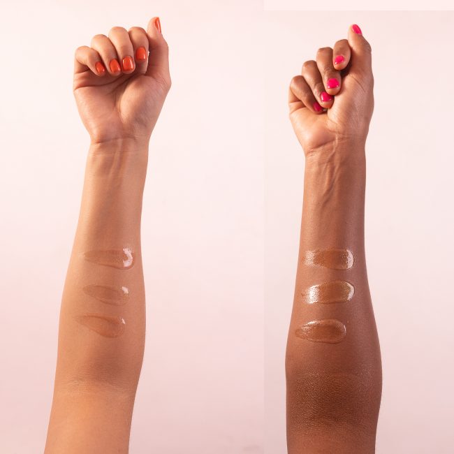 close up of body oil streaked on inside forearm of two different skin tones