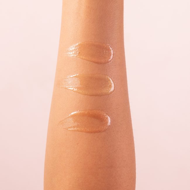 close up of body oil streaked on inside of forearm